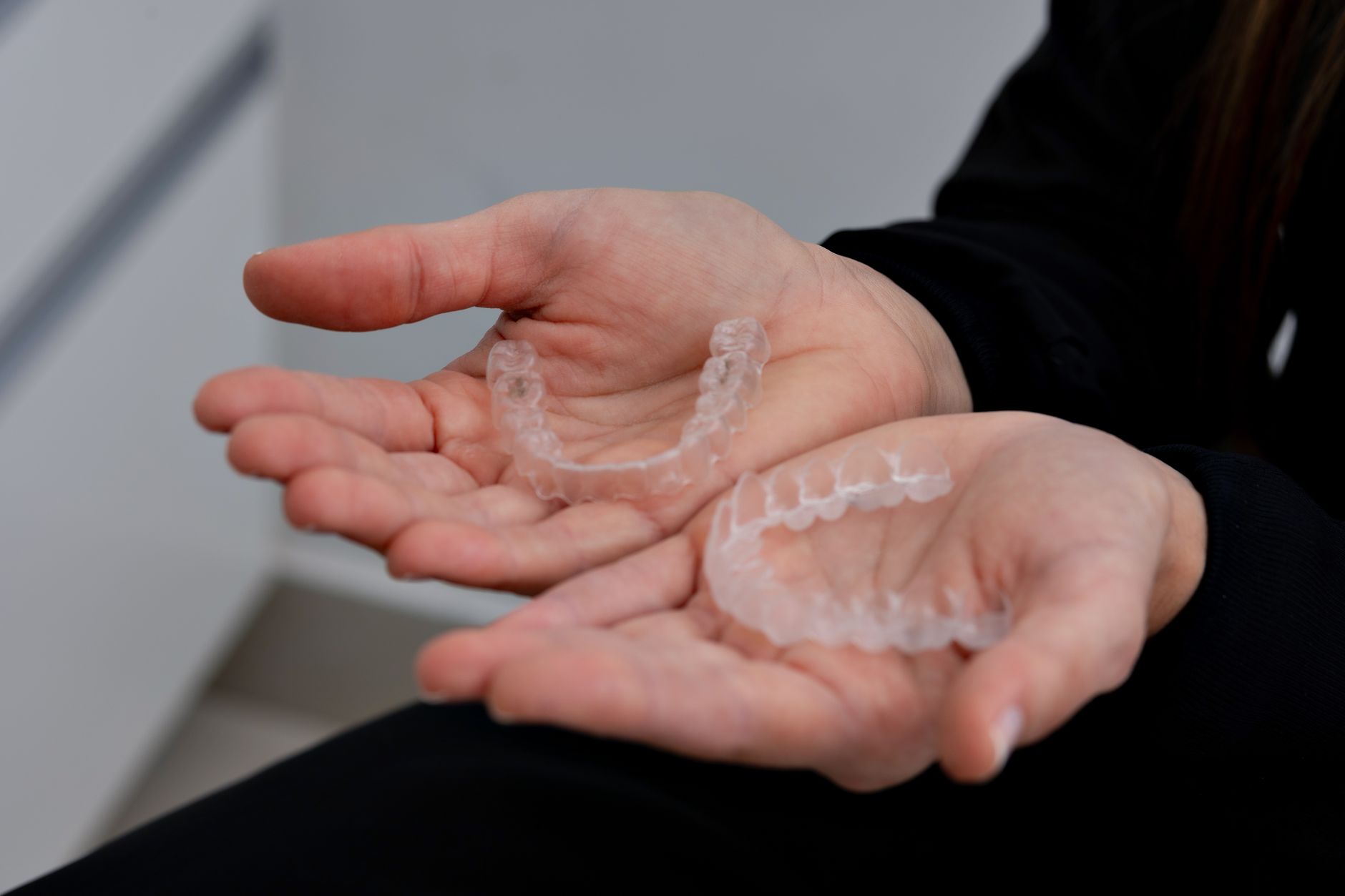 Set of clear orthodontic aligners used to straighten teeth